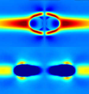 Image from a numerical simulation showing the fluid velocity during a collision between two water droplets in oil. The immobile surface droplets (upper pair) re-coalesce after an initial bounce, whereas the mobile surface droplets (lower pair) bounce apart without coalescing.