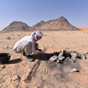 Excavation of an ancient hearth at Jebel Oraf in northern Saudi Arabia. Neolithic groups camped here alongside an ancient lakeshore, in some cases surviving through drought periods.