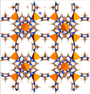 Schematic representation of the porous MOF structure: the orange pyramids represent metallic groups and bonded lines represent organic linkers and surface groups.