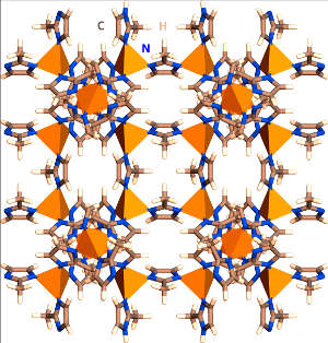 Schematic representation of the porous MOF structure: the orange pyramids represent metallic groups and bonded lines represent organic linkers and surface groups.