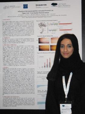 
Hamda Al-Thawadi standing next to her poster on ovarian cancer and thrombosis.
