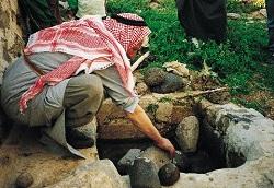 
A village elder opens up a new reservoir near Shallalah as Saghirah, Syria
