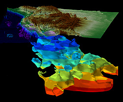 北米西部の山岳地帯と原始太平洋プレート（海面～深さ1,500 km）の3D画像。プレートの色は深さ200 kmごとに変化している。